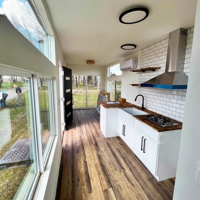 Cabin kitchen with subway tile and butcher block counters